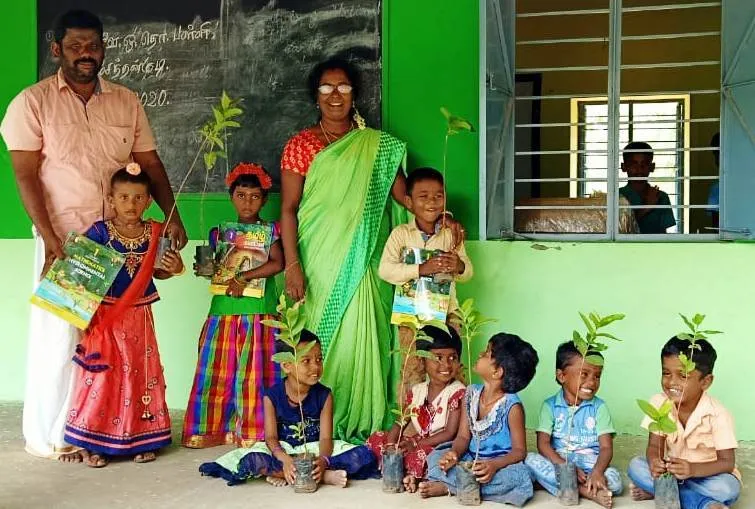  Schools open .. young people  welcome the students with trees